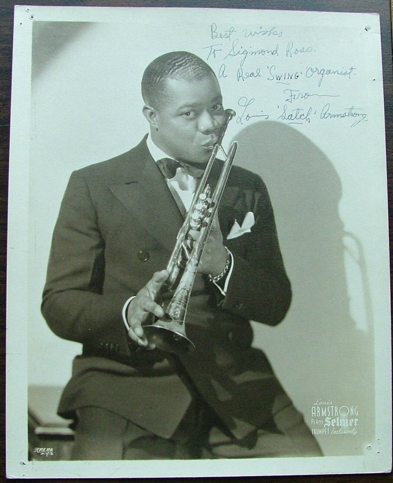 Item #194 A Young Louis Armstrong Signed 8x10 Matte-Finish Photo