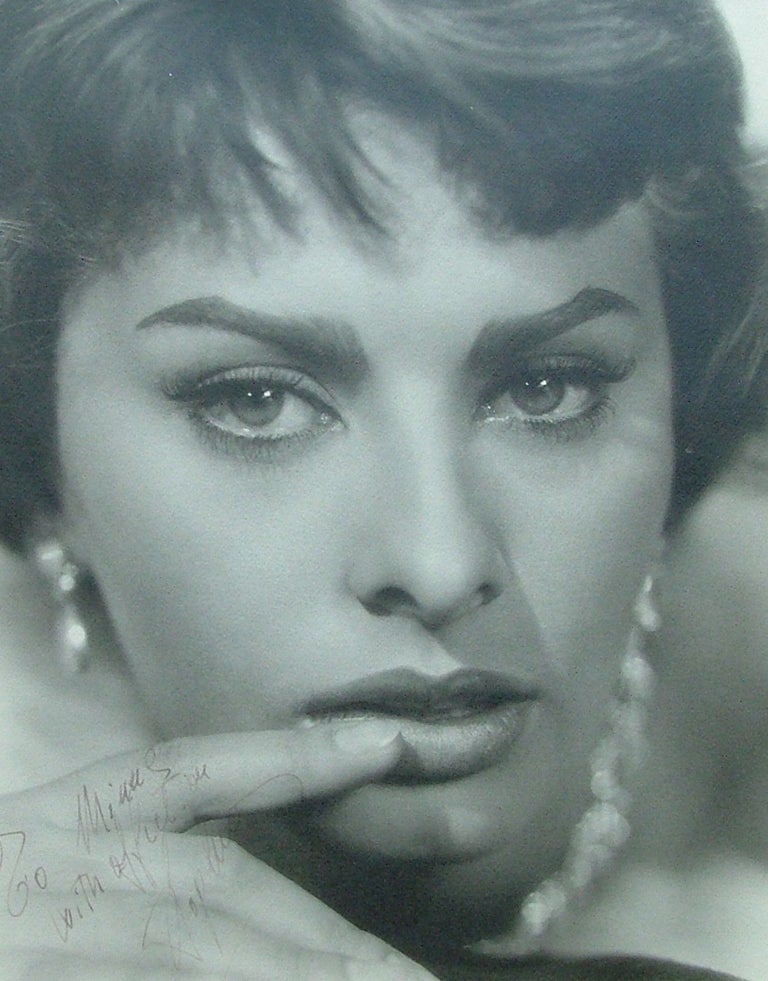 Item #94 Sophia Loren - Signed 11" x 14" matte f inish, close up photo, framed. Fine condition.