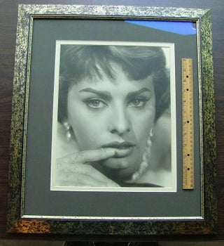 Sophia Loren - Signed 11" x 14" matte f inish, close up photo, framed. Fine condition.